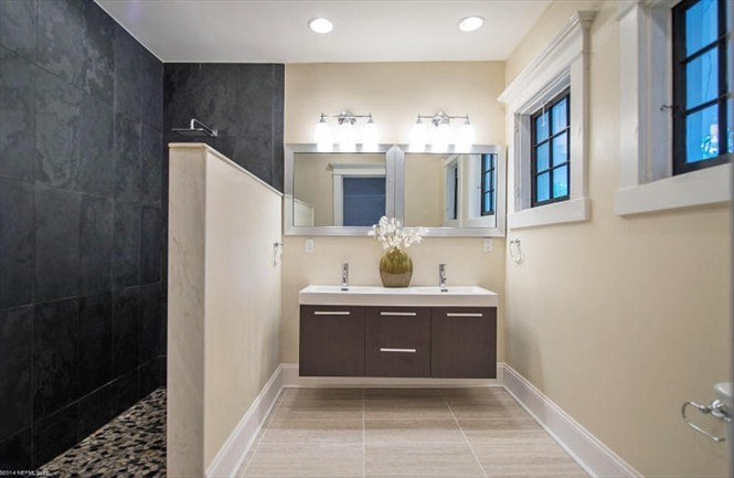 Master bath has contemporary feel, with slate walk-in shower and 